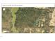 A detailed parcel map showing the property's location in a wooded area near a community at 420 Spring Ln, Henderson, NC 27537