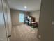 Storage room with stacked plastic boxes and carpeted floors at 420 Spring Ln, Henderson, NC 27537