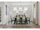 Elegant dining room featuring modern chandelier lighting and stylish wainscoting at 445 Olivia Crossing Ct # 22, Four Oaks, NC 27524