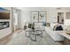 Bright living room with a fireplace, comfortable white sectional, and modern decor at 445 Olivia Crossing Ct # 22, Four Oaks, NC 27524