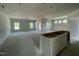 Unfinished open-concept area with large windows, ideal for customization to suit your lifestyle at 445 Olivia Crossing Ct # 22, Four Oaks, NC 27524