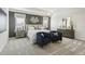 Serene primary bedroom featuring a tray ceiling, elegant lighting, and neutral tones at 445 Olivia Crossing Ct # 22, Four Oaks, NC 27524