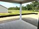 View from the covered patio out to the backyard and wooded property line at 445 Olivia Crossing Ct # 22, Four Oaks, NC 27524