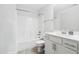 Neat bathroom features vanity sink with cabinets, toilet, and shower and tub combo with white walls at 46 Waterfall Pointe, Chapel Hill, NC 27517