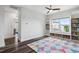 Bedroom with built-in bookshelves, window seating, and hardwood floors at 46 Waterfall Pointe, Chapel Hill, NC 27517