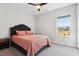 Bedroom featuring a plush bed, a ceiling fan, and a bright window view at 46 Waterfall Pointe, Chapel Hill, NC 27517