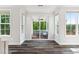 Open floor plan featuring a seamless transition from the living room to the screened outdoor living space at 46 Waterfall Pointe, Chapel Hill, NC 27517