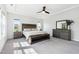 Spacious main bedroom with neutral tones, ceiling fan, and lots of natural light at 46 Waterfall Pointe, Chapel Hill, NC 27517