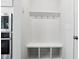 Clean mud room with built-in bench, storage cubbies, and coat hooks at 46 Waterfall Pointe, Chapel Hill, NC 27517