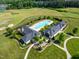 Aerial view of the neighborhood clubhouse featuring a large pool, and abundant seating at 46 Waterfall Pointe, Chapel Hill, NC 27517