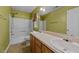 Bathroom with double sinks, a large mirror, and a shower/tub combination at 468 Hay River St, Garner, NC 27529