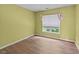 Cozy bedroom with wood flooring and a window view at 468 Hay River St, Garner, NC 27529
