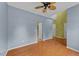 A spacious bedroom with wood floors, vaulted ceilings, and neutral paint colors at 468 Hay River St, Garner, NC 27529