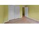 Bright bedroom featuring hardwood floors, light yellow walls, and a spacious closet at 468 Hay River St, Garner, NC 27529