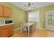 Breakfast nook with a table and chairs with views of the outdoor area at 468 Hay River St, Garner, NC 27529
