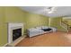 A cozy living room with a fireplace and stairs leading to the second floor at 468 Hay River St, Garner, NC 27529
