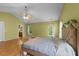 Sunlit main bedroom featuring a vaulted ceiling and a view to the ensuite bathroom at 468 Hay River St, Garner, NC 27529