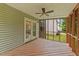 Screened porch with ceiling fan and wood flooring, perfect for relaxing outdoors at 468 Hay River St, Garner, NC 27529