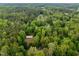 Lush green forest surrounding the property creates a private and tranquil setting at 4701 Brock Dr, Hurdle Mills, NC 27541