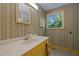 Charming bathroom with marble countertop, stylish mirror, and a bright window at 4701 Brock Dr, Hurdle Mills, NC 27541