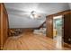 Spacious bedroom with wood paneling, hardwood floors and ensuite bathroom at 4701 Brock Dr, Hurdle Mills, NC 27541