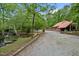 Charming home near a creek with metal roof, brick foundation, covered patio, and large driveway at 4701 Brock Dr, Hurdle Mills, NC 27541