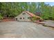 Charming one-story home with a metal roof and spacious gravel driveway at 4701 Brock Dr, Hurdle Mills, NC 27541