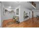 Inviting foyer with hardwood floors, a seating bench, and access to upper levels of the home at 4701 Brock Dr, Hurdle Mills, NC 27541