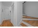 Hallway features hardwood floors, and stairs with wood treads at 4701 Brock Dr, Hurdle Mills, NC 27541