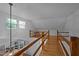 Loft area features wood railings and overlooks the first floor at 4701 Brock Dr, Hurdle Mills, NC 27541