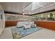 Bright sunroom with large windows, skylights, brick accents, and comfortable seating at 4701 Brock Dr, Hurdle Mills, NC 27541