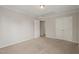 Neutral bedroom with neutral carpet, two closets, and crown molding at 4703 Kings Garden Rd, Raleigh, NC 27612