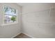 Walk-in closet featuring wire shelving and a window at 4703 Kings Garden Rd, Raleigh, NC 27612
