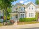 Inviting home with a stone-accented facade, cozy front porch, and lush landscaping creating a welcoming curb appeal at 4703 Kings Garden Rd, Raleigh, NC 27612