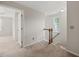 Hallway with carpeted floor, stairs and window at 4703 Kings Garden Rd, Raleigh, NC 27612