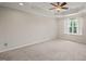 Spacious main bedroom features a tray ceiling and a window at 4703 Kings Garden Rd, Raleigh, NC 27612