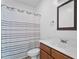 Cozy bathroom offers a vanity with wood cabinets and a shower-tub combination at 494 Asset Pkwy, Sanford, NC 27332