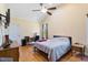 Comfortable bedroom with hardwood floors, a ceiling fan, and natural light, creating a tranquil retreat at 494 Asset Pkwy, Sanford, NC 27332