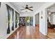 Bright bonus room features hardwood floors, a wall of windows, and a bookshelf, perfect for a home office at 494 Asset Pkwy, Sanford, NC 27332