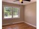 Bedroom features gleaming hardwood floors and a sun-filled window at 502 Burton St, Fuquay Varina, NC 27526