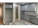 Modern kitchen featuring granite countertops, new stainless steel appliances, gray cabinets, pantry and luxury vinyl flooring at 502 Burton St, Fuquay Varina, NC 27526
