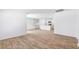 Spacious living room showcases wood-look floors and an open view of the kitchen at 505 Lochalsh Dr, Gibsonville, NC 27249