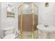 Bathroom featuring a shower stall, sink, and toilet, creating a functional space at 5062 Dorsey Rd, Oxford, NC 27565