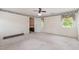 Bedroom with neutral carpet, ceiling fan, and natural light through windows at 5062 Dorsey Rd, Oxford, NC 27565
