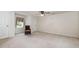 Bedroom showcasing neutral walls, carpeted flooring, window and a chair at 5062 Dorsey Rd, Oxford, NC 27565