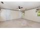 Spacious bedroom featuring a ceiling fan, carpeting, and natural light from windows at 5062 Dorsey Rd, Oxford, NC 27565