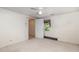Bedroom with neutral walls, carpeted flooring, a ceiling fan, and a door opening to an adjacent room at 5062 Dorsey Rd, Oxford, NC 27565