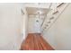 Interior view of the foyer with beautiful hardwood floors and a staircase leading to the upper level at 5062 Dorsey Rd, Oxford, NC 27565