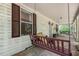 Inviting front porch with rustic wood porch swing, a perfect spot to relax and enjoy the outdoors at 5062 Dorsey Rd, Oxford, NC 27565