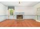 Living room has hardwood floors and a traditional fireplace at 5062 Dorsey Rd, Oxford, NC 27565